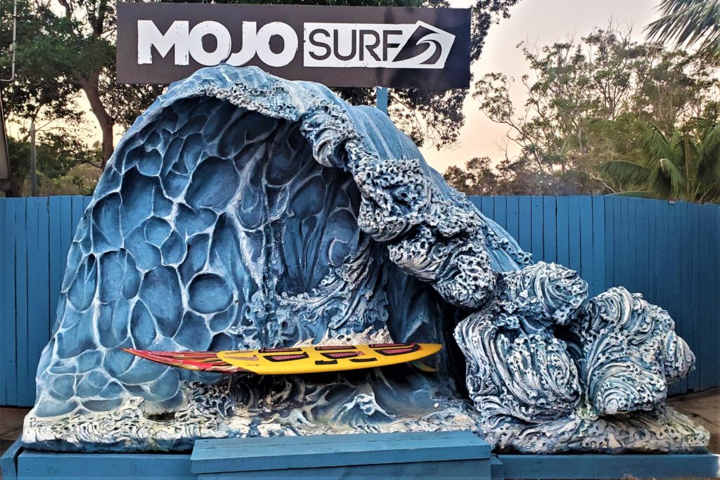 Mojosurf Wave sign with surfboard